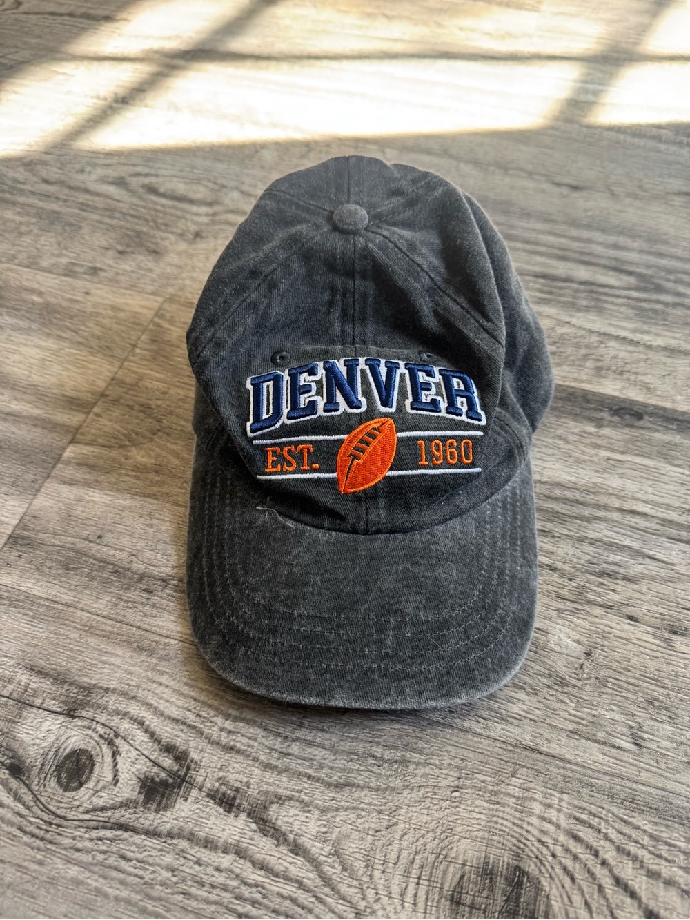 Denver Embroidered Black Baseball Cap with Orange Accent